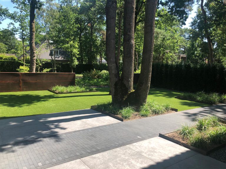 Tuin van vrijstaand huis met luxueuze buitenkamer De Groot Tuinen